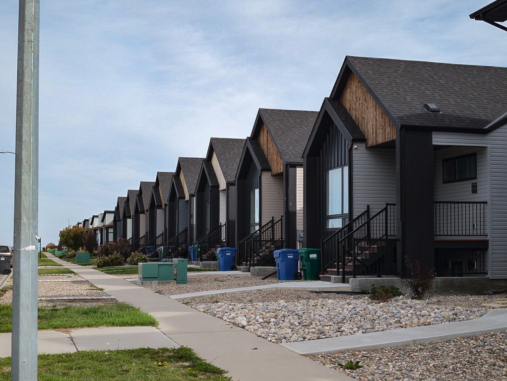 Lethbridge alberta north side housing developments, long street with photo of houses in the suburb taken at an angle.